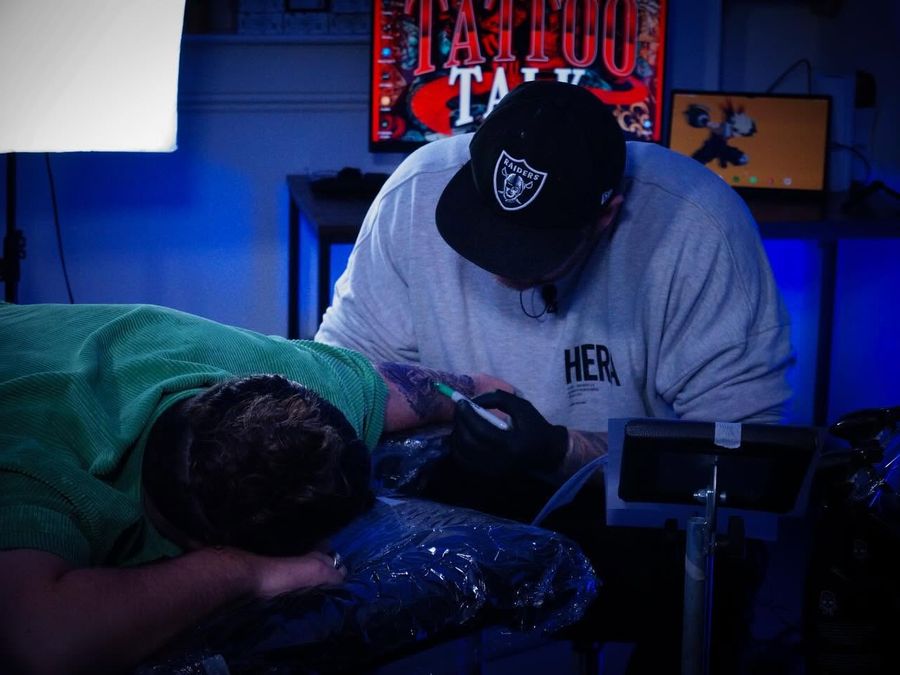 Recording a podcast during a tattoo session
